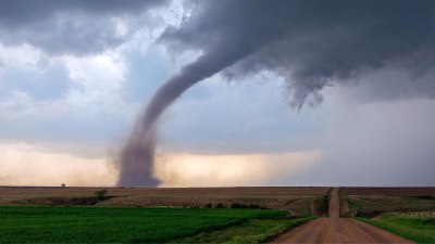 Why Tornadoes Prefer Flat Terrain