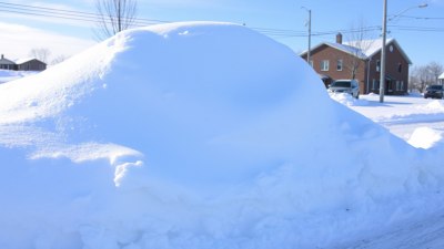 The Physics of Snowbanks That Never Shrink